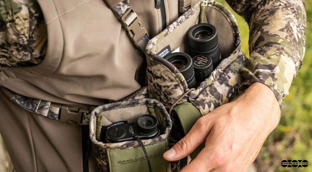 man with a binocular harness set up